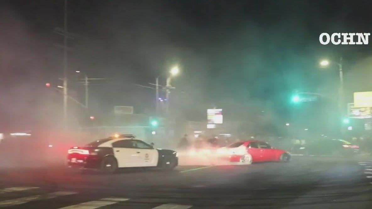 Van Nuys street takeover: Police window smashed